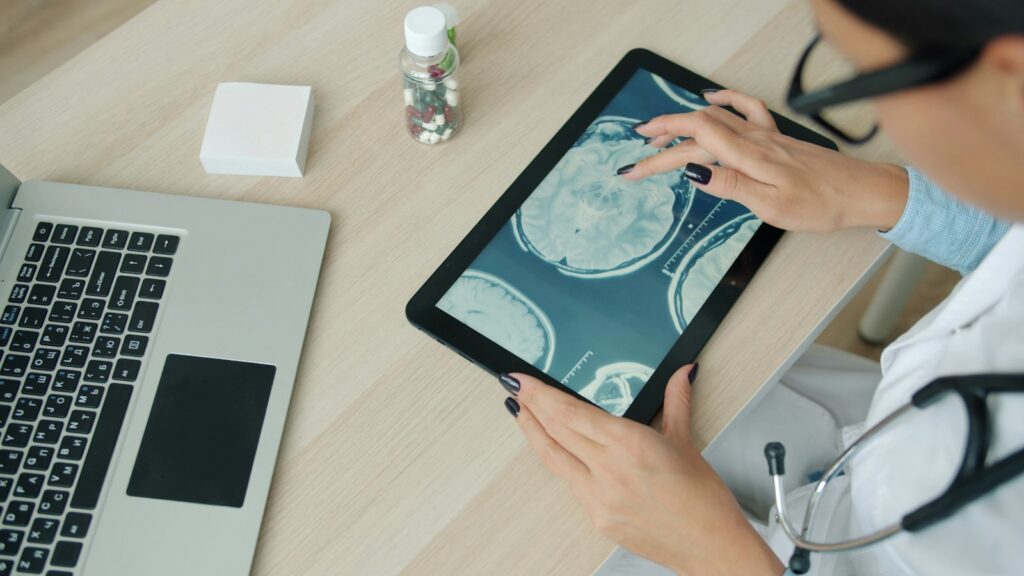 Reviewing health data on a tablet at a desk