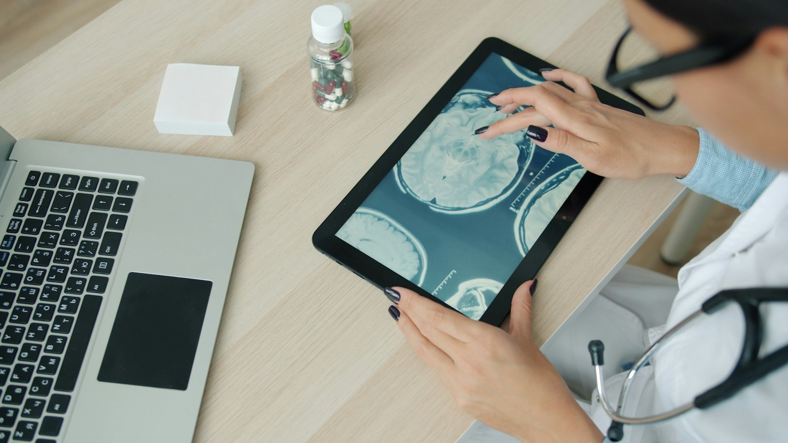 Reviewing health data on a tablet at a desk